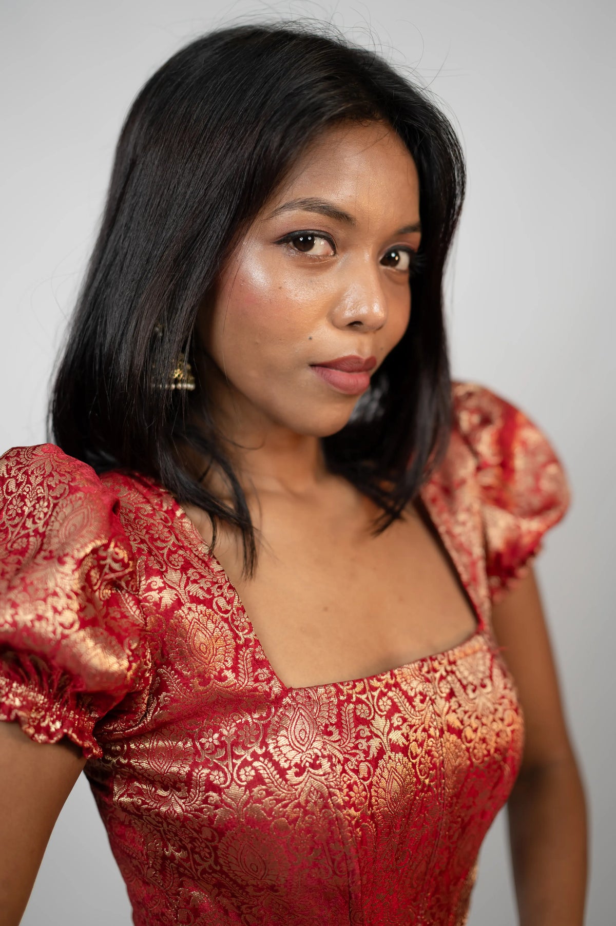 crimson brocade puff sleeve corset from the wear712 onam collection