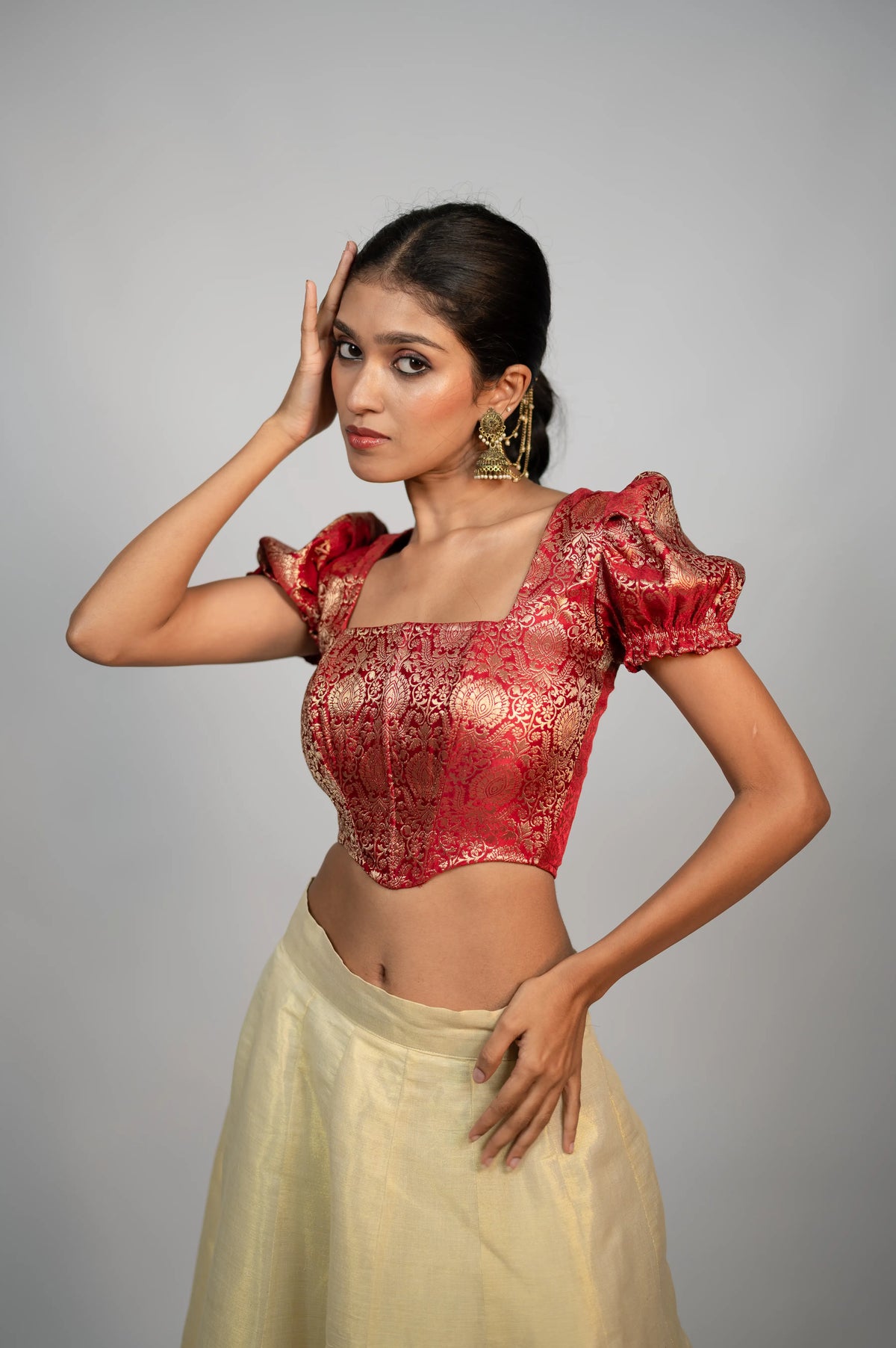 Crimson Noor crimson brocade puff sleeve corset styled with ivory skirt