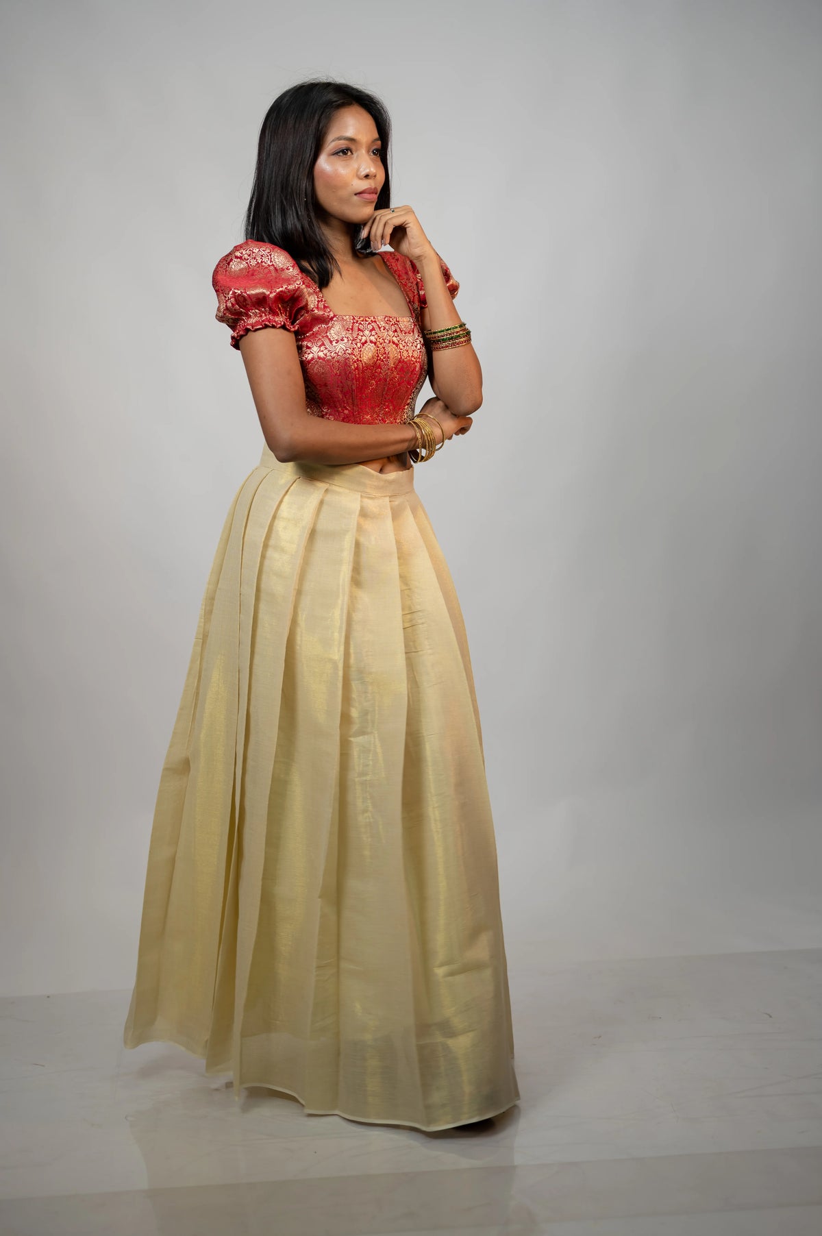 Back three-quarter view of Crimson Noor crimson brocade corset with puff sleeves