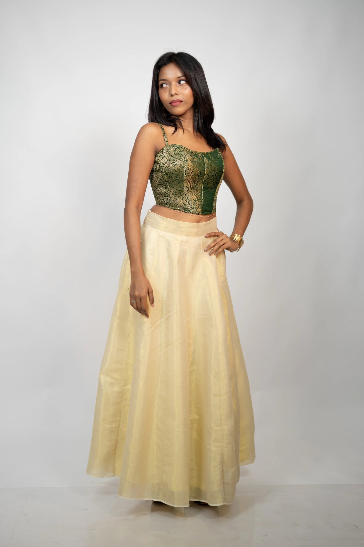 Emerald Elan green brocade corset styled with an ivory skirt