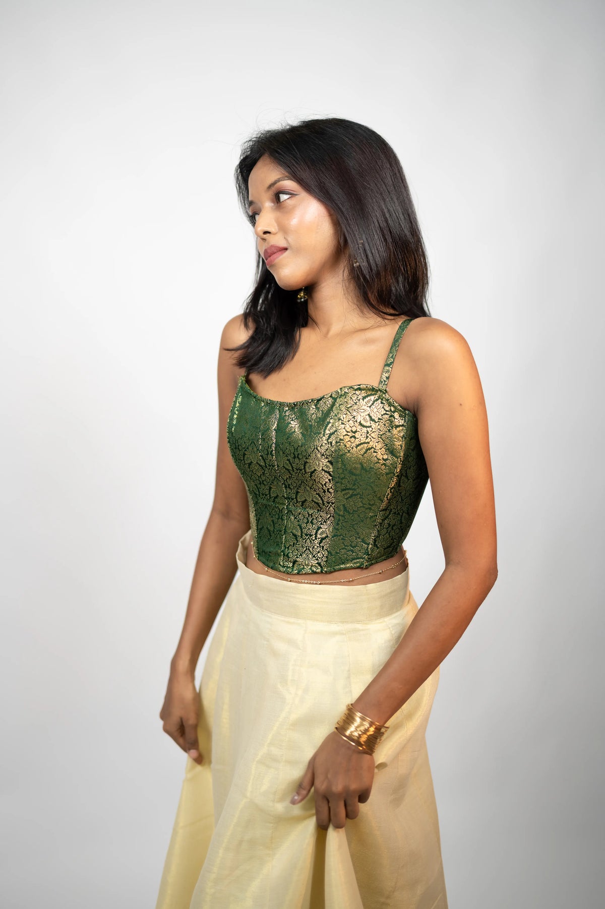 Emerald Elan green brocade corset angled front view with ivory skirt