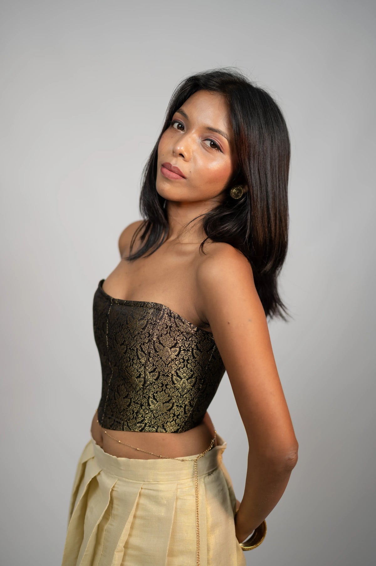 Nocturne Zari black antique gold brocade corset three-quarter view
